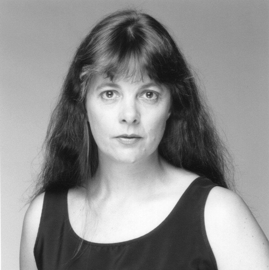 Looking into the camera.